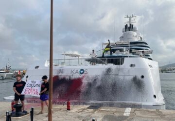 Eco protesters spray paint on a superyacht in Spain.