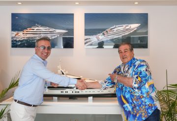 Berkay Yilmaz of Bilgin yachts (left) shakes hands with John Staluppi over Project Bond.