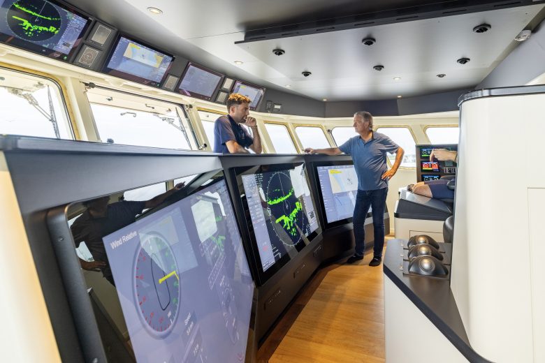 Erik Vonk (right) on the bridge, which includes dynamic positioning.
